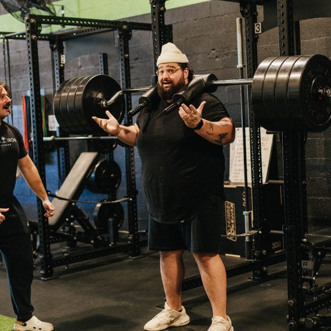 Farris Holliday training with Oak and Iron Personal Trainer Andrew Barsuhn. Farris is about to perform Safety Bar Squats.