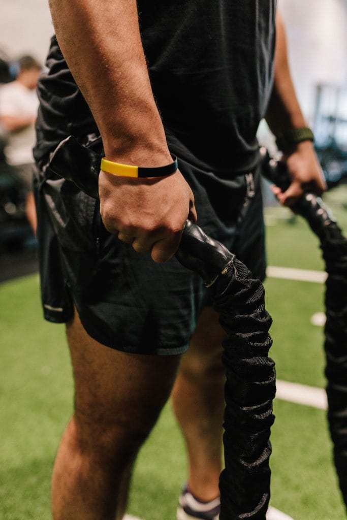 Howard Johnson 5 Coach guiding Drive program participants through conditioning drills at Oak and Iron Fitness