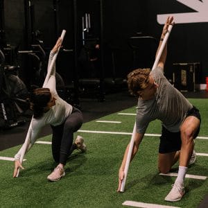Community Spotlight: Dr. Cory Bailey at Triangle Chiropractic & Rehabiliation Center 3 Recovery and Mobility. Liam and Liz leading a mobility and recovery session at Oak and Iron Fitness
